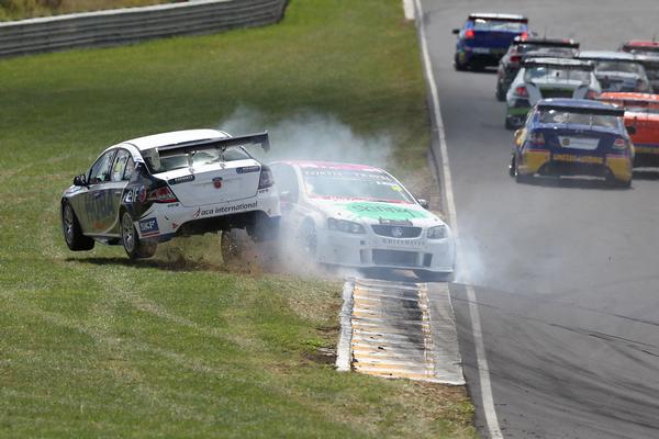 Corkery left and Moore clash during the Feature Race